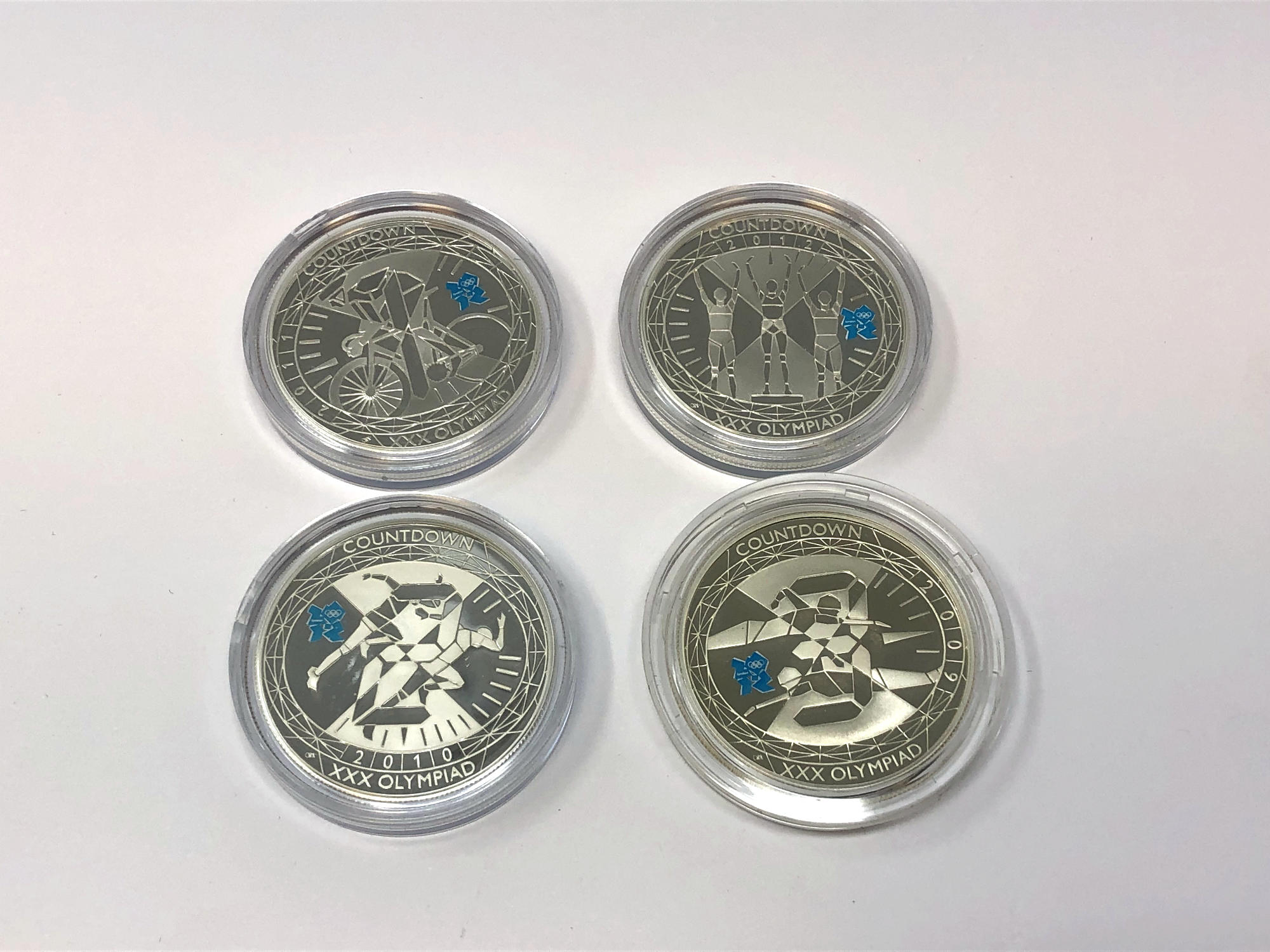 Four London 2012 Olympics silver proof commemorative crowns.