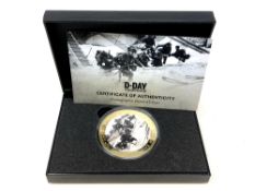 The D-Day Photographic 65mm £5 Coin, boxed with certificate of authenticity.