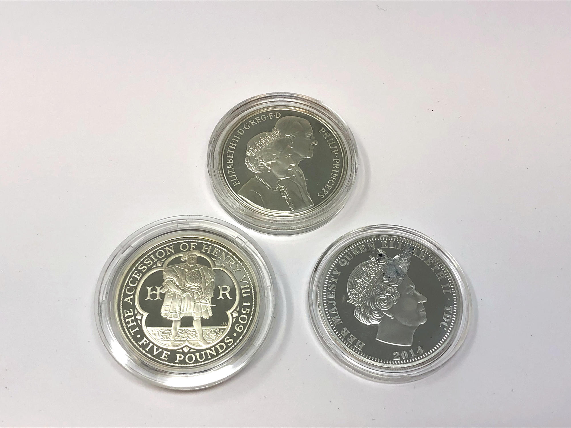 Three Elizabeth II silver commemorative crowns.