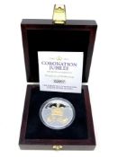 A queen Elizabeth II Coronation Jubilee Silver £5 Coin, boxed with certificate of authenticity.