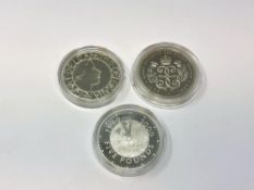 Three Elizabeth II silver commemorative crowns.