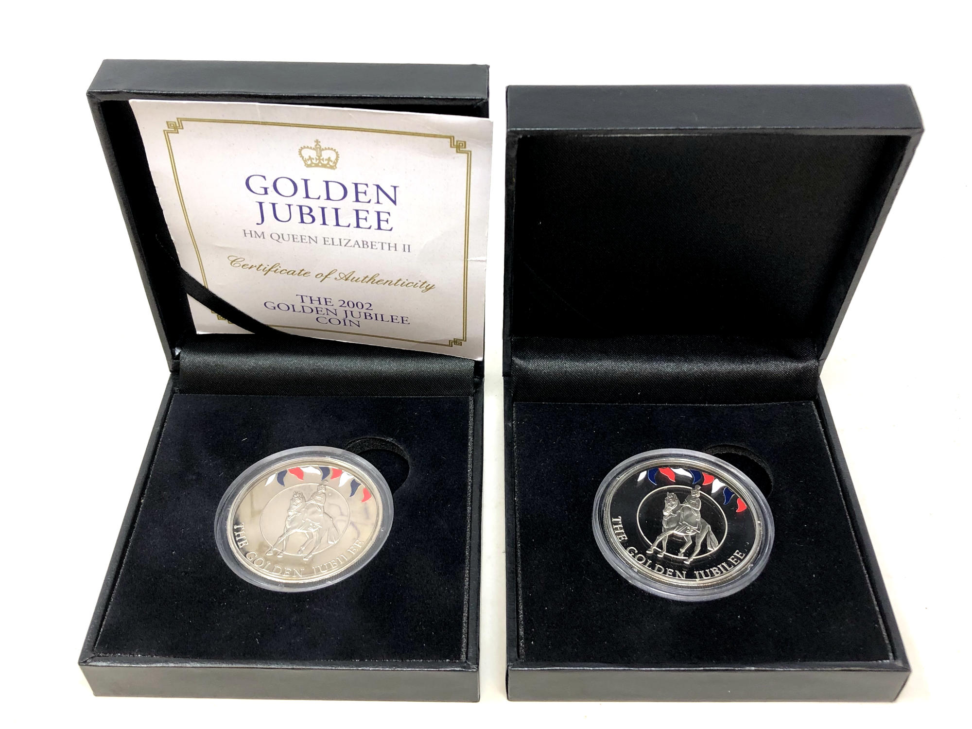 Two 2002 Golden Jubilee Commemorative Coins, boxed with one certificate.