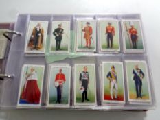 An album containing a large quantity of cigarette cards by John Player to include film stars,