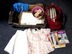 A box of vintage girl's dresses, 20th century purse, sewing items,