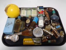A tray containing a quantity of vintage perfumes and perfume bottles to include Avon, Dior,