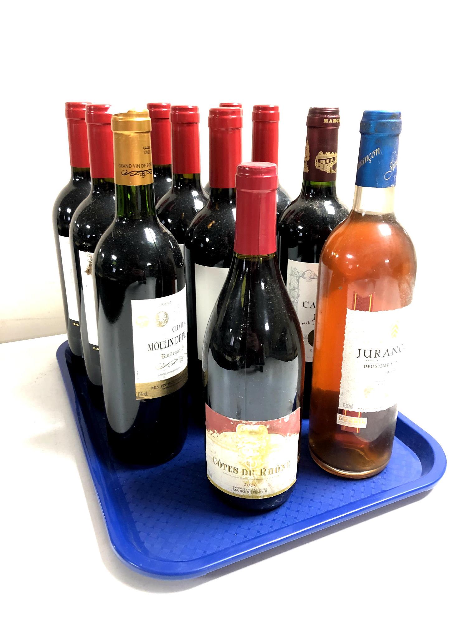 A tray containing eleven assorted bottles of wine