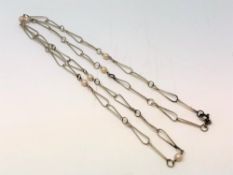 A silver and pearl necklace, length 80 cm.