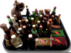 A tray containing a quantity of alcohol miniatures and bottles