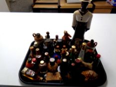 A tray containing a quantity of alcohol miniatures and bottles