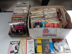 Two boxes of a large quantity of mid 20th century vinyl 7" singles, Sinatra, Frankie Laine,