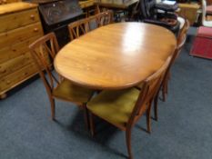 A 20th century teak G Plan oval extending dining table together with six chairs,