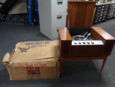 A HMV teak cased record player on stand together with original box bearing advertisement