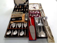 A tray containing a large quantity of plated cutlery to include cake forks, teaspoons,