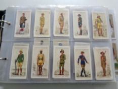 An album containing a large quantity of Wills and John Player cigarette cards,