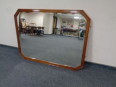 A contemporary bevelled octagonal overmantel mirror