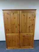 A contemporary pine double door wardrobe, height 170 cm,