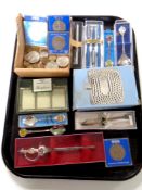 A tray containing foreign coins, crowns, boxed commemorative spoon and letter opener,
