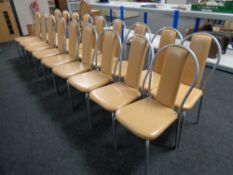 A set of eighteen metal framed restaurant chairs upholstered in vinyl