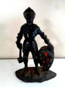 A 19th century cast iron doorstop in the form of a knight,