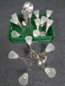 A pair of chrome five way light fittings with glass shades,