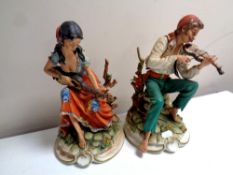 Two Capodimonte figures, Romani lady with guitar and Romani man with violin,