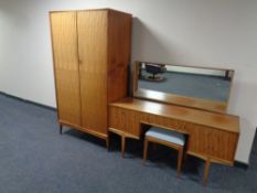 A 20th century Mcintosh five piece teak bedroom suite comprising of double door wardrobe,