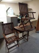 A teak garden drop leaf table together with two folding chairs