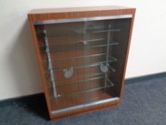 A collector's cabinet with sliding glass doors fitted five internal shelves bearing Swarovski swan