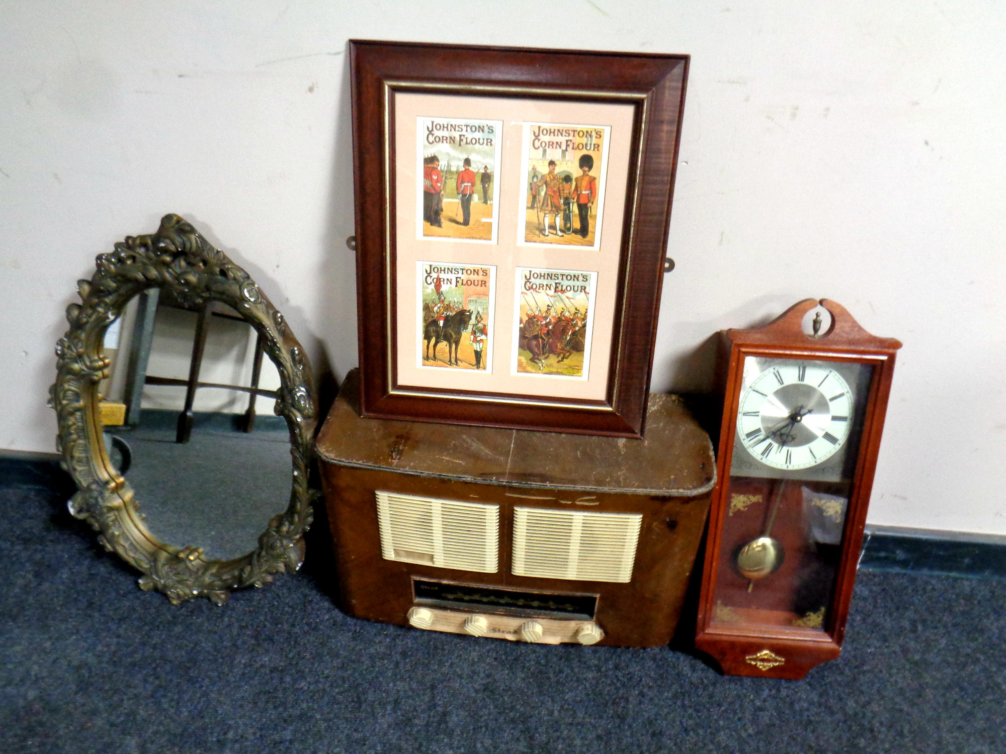 A box containing valve radio, gilt chalk mirror, wall clock,