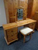 A contemporary pine six drawer knee hole dressing table with mirror and stool,