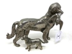 A heavy silver plated model of a retriever holding game,