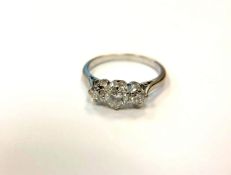 An 18ct white gold three stone diamond ring, size O. CONDITION REPORT: 2.