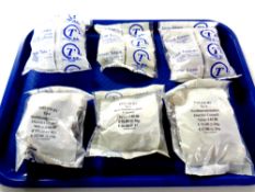 A tray containing six bags of unused travel tokens issued by East North Hamptonshire