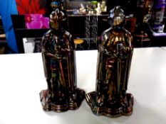 Two lustre cast iron Knight companion stands