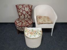 A mid 20th century bedroom chair upholstered in a floral brocade fabric,