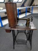 A 20th century Singer treadle sewing machine in table