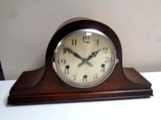 A 1930s oak cased Enfield mantel clock with silvered dial