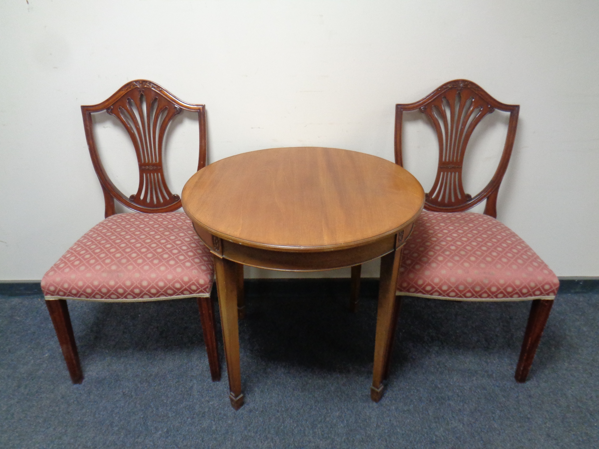 A pair of reproduction shield back dining chairs together with a circular Edwardian occasional