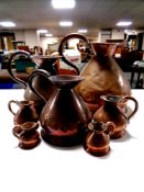 A set of seven 19th century graduated copper jugs