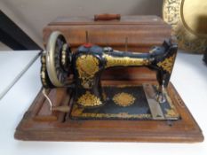 A vintage Jones hand sewing machine in case