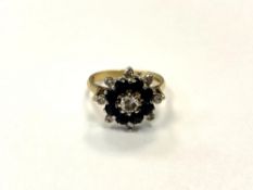 An 18ct yellow gold diamond and sapphire cluster ring, size L/M, 4.7g.