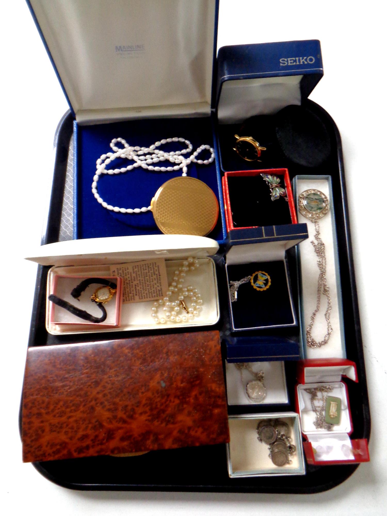 A tray containing costume and silver jewellery, compact, gent's Seiko wristwatch,