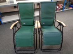 A pair of Sun Coast folding garden loungers with bags