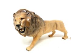 A Beswick china figure : Lion (Facing Left), model 2089, golden brown, gloss, height 14 cm.