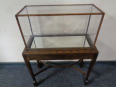 A display cabinet on an oak stand, total height 94.