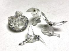 Four Swarovski crystal figures, duck with ducklings, hummingbird, toucan,