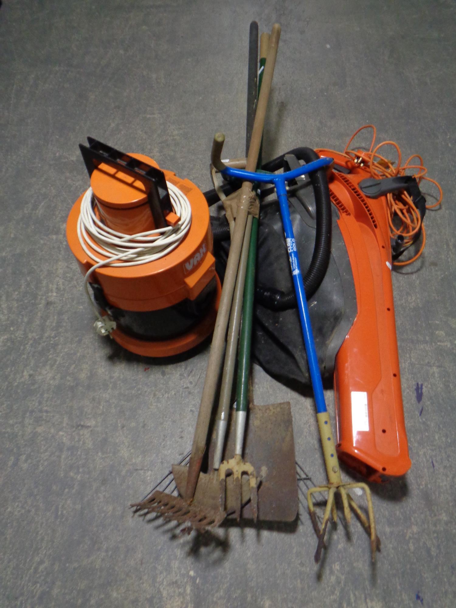 A Vax with hose together with a Flymo garden vacuum and a bundle of garden tools