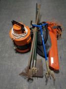 A Vax with hose together with a Flymo garden vacuum and a bundle of garden tools