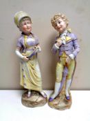 A pair of antique continental bisque figures,