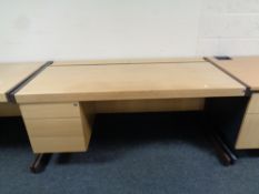A metal framed single pedestal desk fitted three drawers,